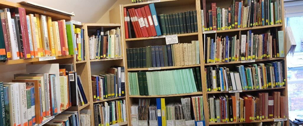 books stacked on shelving